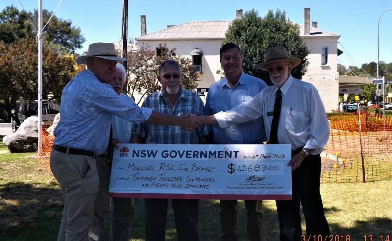 PRESENTATION: Rick Colless, Barry King, Norm Carpenter, Cabonne council mayor Kevin Beatty and David  Bloomfield at the memorial site on Saturday. Photo: Supplied