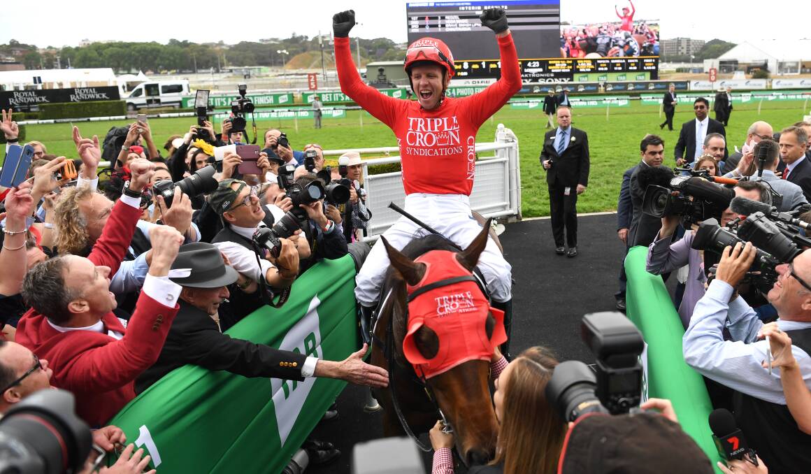 BEST EVER: Co-owners celebrate as jockey Kerrin 
McEvoy on Redzel returns to scale after winning 
The Everest race on Saturday. Photo: AAP