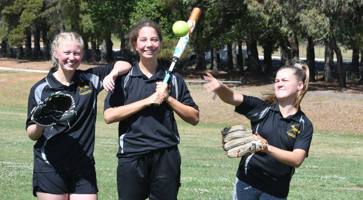 READY FOR ACTION: Orange softballers Montana Griffith, Ineke Keed and Alana Tracey fly to Perth on Friday. Photo: JUDE KEOGH 0102jksoftball3