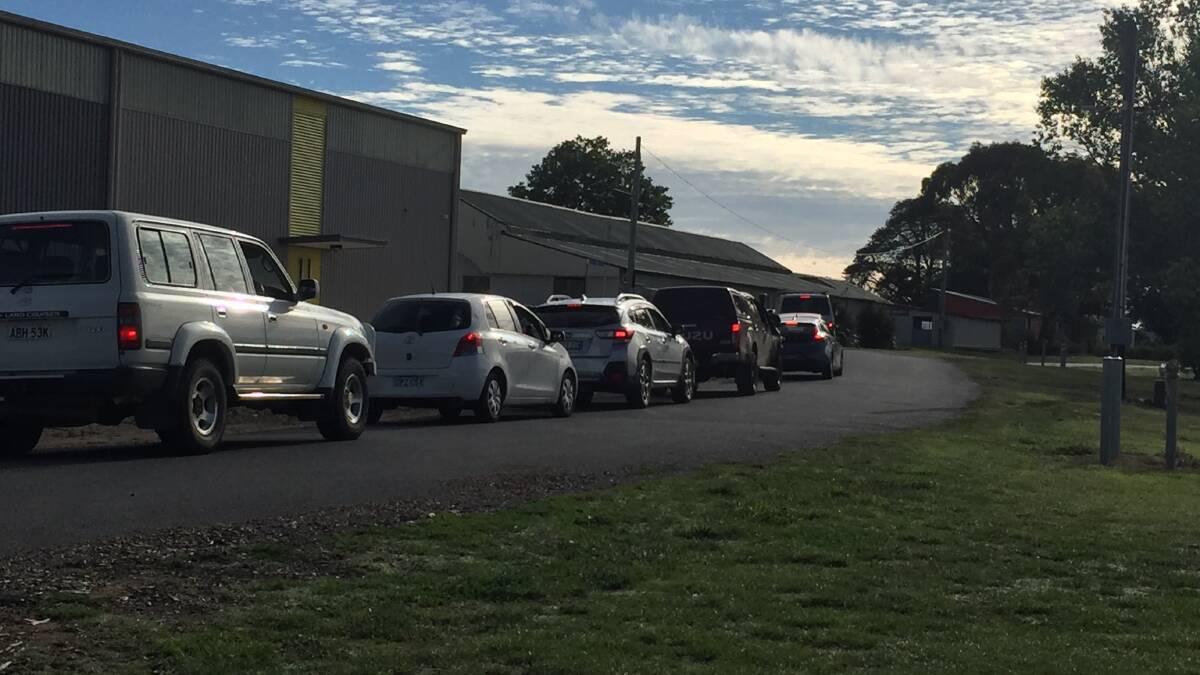 LINE-UP: Cars queue for COVID tests at the Orange Showground.