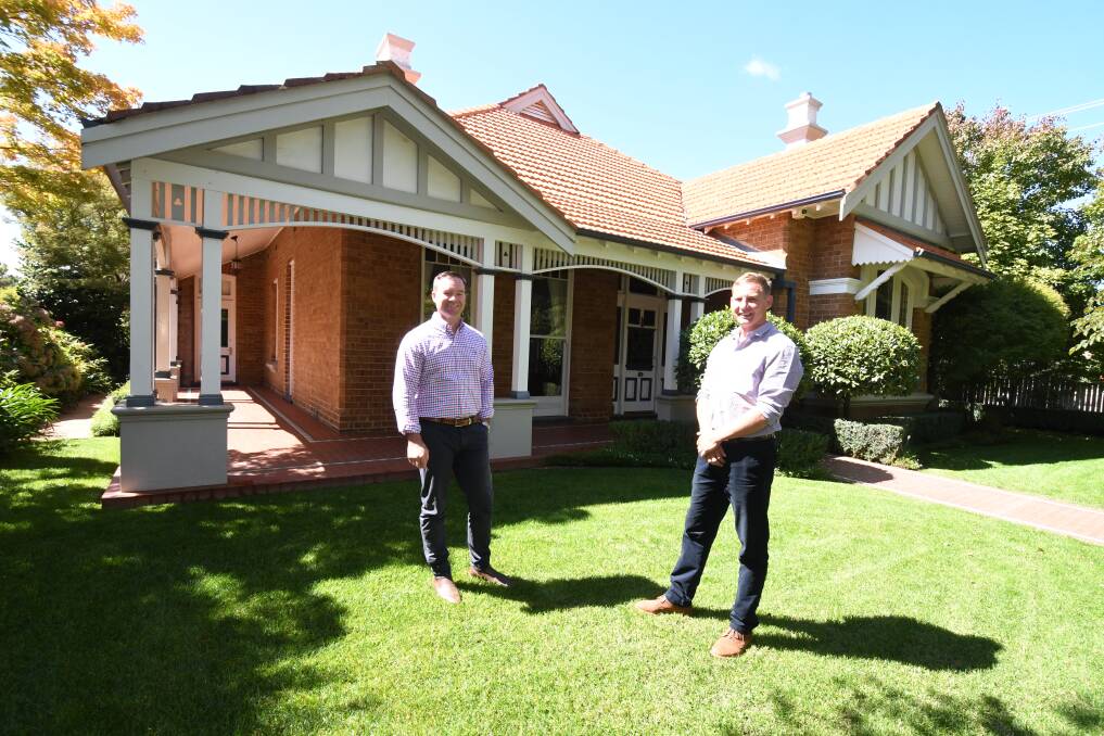 TOP PRICE: Real estate agents Josh Fitzgerald and Scott Petersen outside the property in Sale Street after it sold for a record-breaking $1.86 million. Photo: JUDE KEOGH