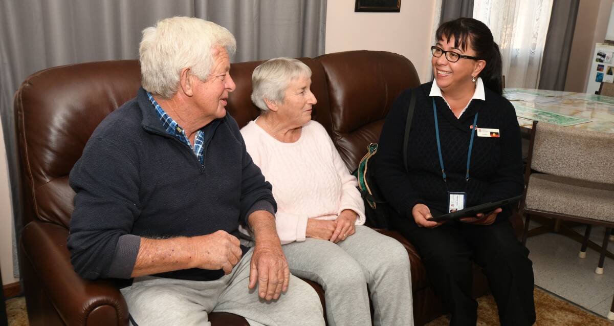 IMPROVEMENTS: Clive and Lynette Noakes discuss their social housing tenancy with FACS Housing client service officer Linda Kinchela. Photo: JUDE KEOGH 0606jkfacs3