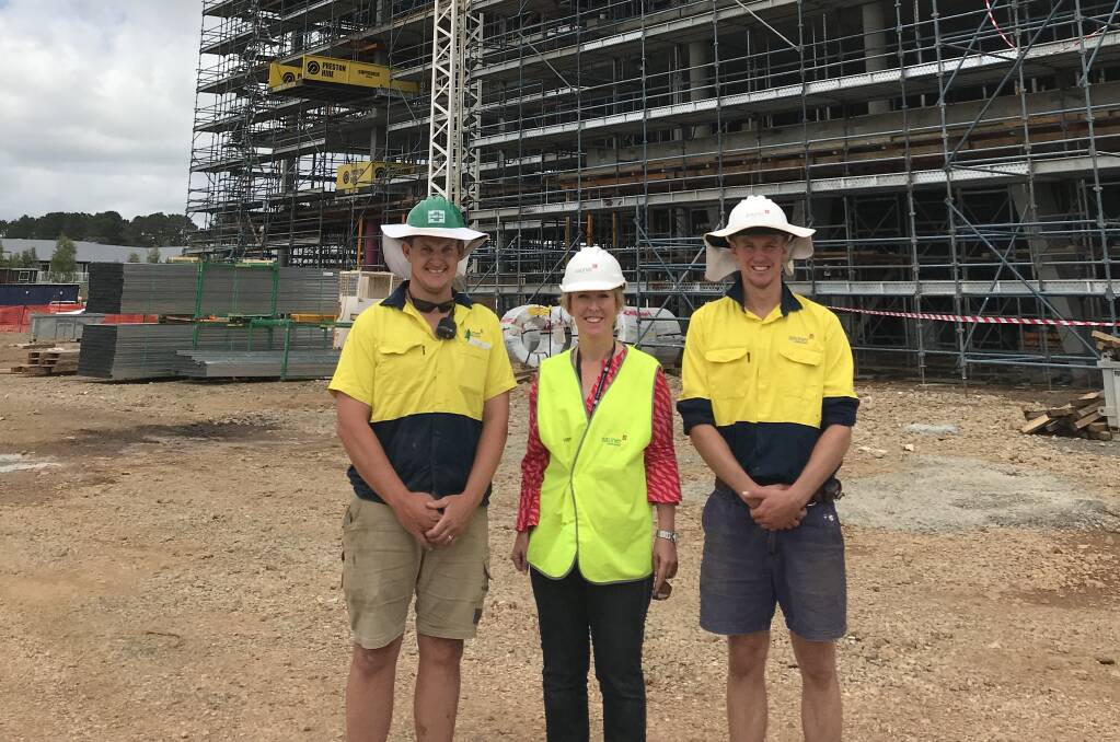 DONATIONS: Site safety officer Peter Bell, RMH executive officer Rebecca Walsh and project engineer Scott Hubbard at the Forest Road construction site. Photo: Supplied