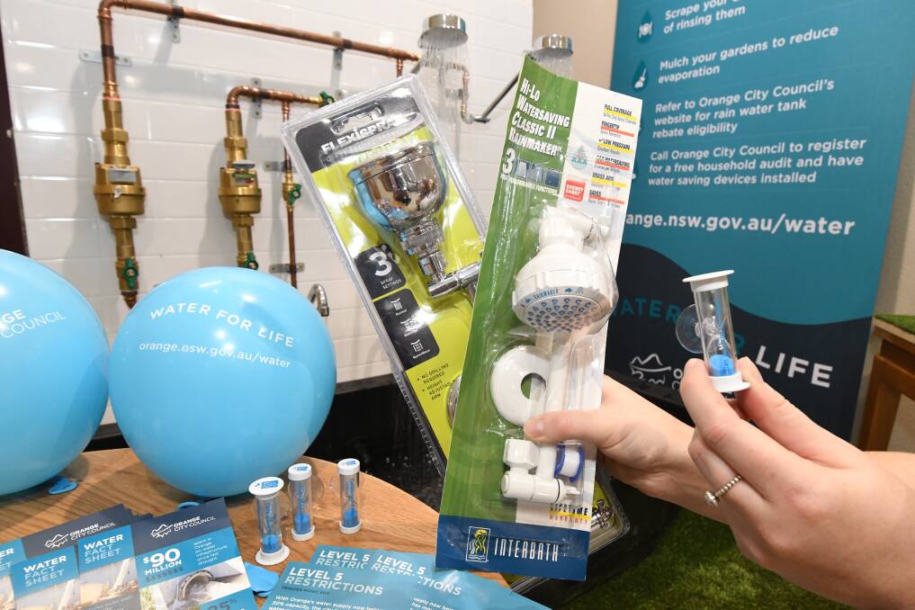 HANDY HELP: Shower heads and timers can be collected for free at the Orange City Council offices. Photo: JUDE KEOGH