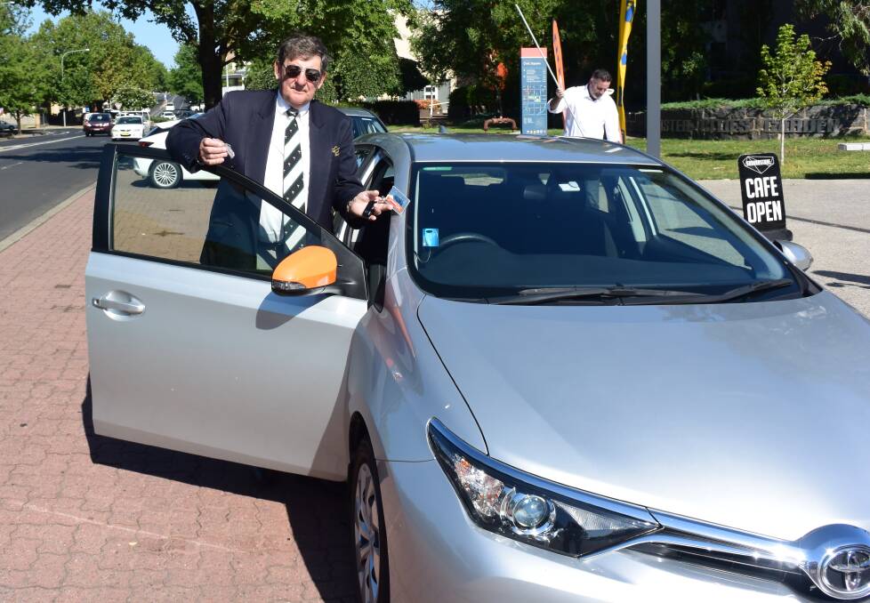 HAVE A GO: Mayor Reg Kidd samples a GoGet car.