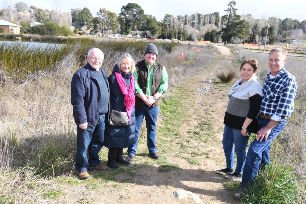 ROOM FOR A BRIDGE: Malcolm Stacey, Kerri Breheny, Glen Pearson, Lindy Glover and Dennis Croucher at the site. Photo: JUDE KEOGH 0717jkwetlands3