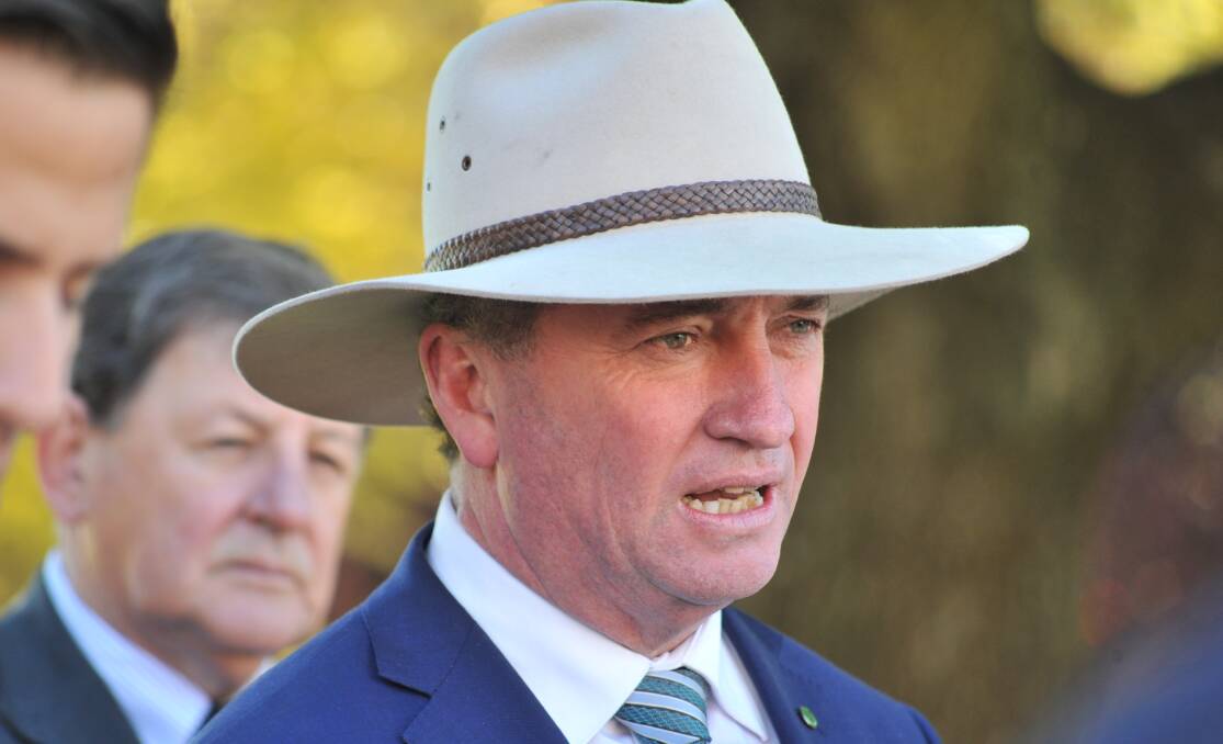 BOUNTY: Deputy Prime Minister Barnaby Joyce announces that Orange will become the rural banking hub in Robertson Park on Tuesday. Photo: JUDE KEOGH