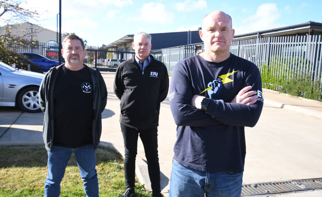 UNION: Electrical Trades Union officials Matt McCann, Peter Moss and Allen Hicks outside TransGrid Orange on Wednesday. Photo: JUDE KEOGH