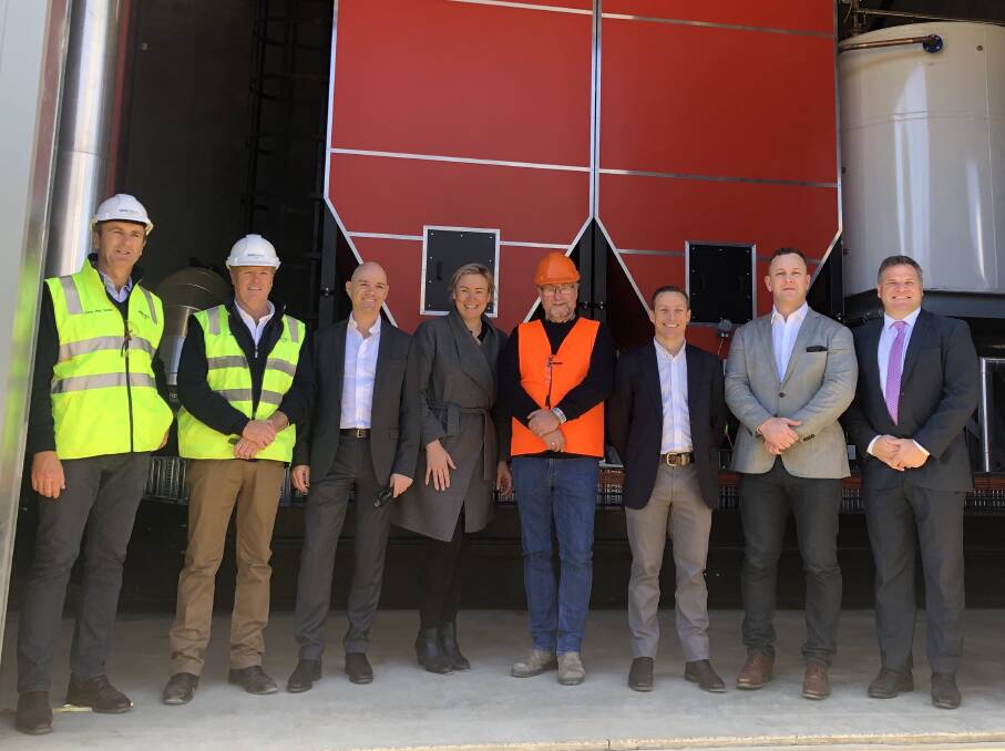 PROUD DAY: Peter Mac Smith, Director MSM Milling, Bob Mac Smith, Director MSM Milling, Darren Miller, ARENA CEO, Shahana McKenzie CEO Bioenergy Australia, Peter Larsen, Justsen, Grant Cairns, CBA Executive GM Regional and Agribusiness Division, Matt Drum - Ndevr Environmental and Phil Donato member for Orange. Photo: Supplied 