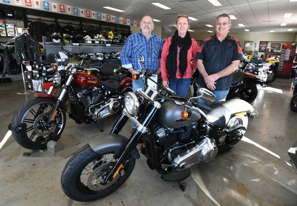 NEW TEAM: Co-owners Steve and Bev Lukas with dealer principal Steve Lowcock. Photo: JUDE KEOGH 0622jkharley1