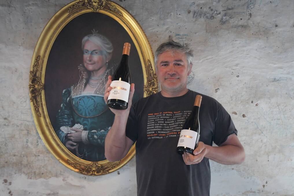 WORKS OF ART: Philip Shaw winemaker Dan Shaw with the winery's two gold-medal winners and a cellar door painting of his mother Di Shaw. Photo: CARLA FREEDMAN