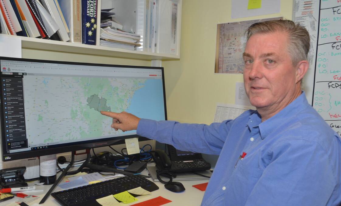 HOT SPOT: Simon Oliver monitors a Rural Fire Service map of fire outbreaks.