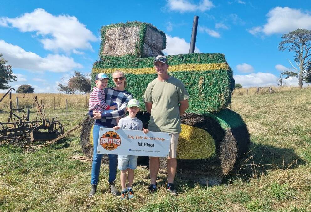 The Stanbridge family with their John Deere Green tractor.