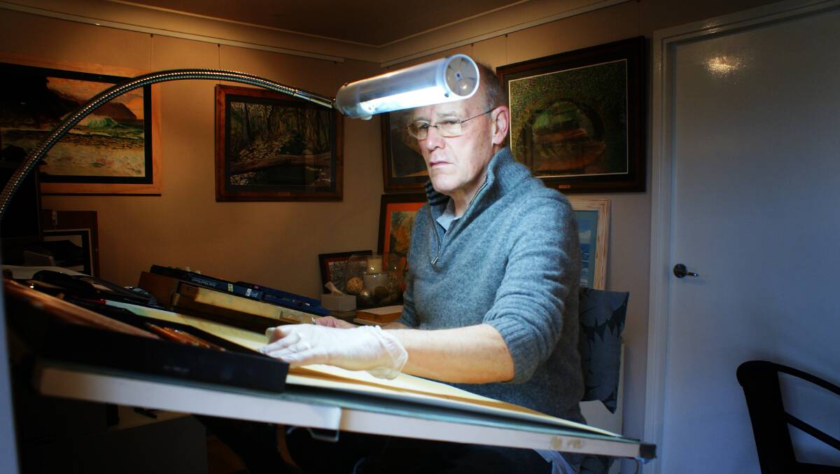 FINE LINES: Peter works mainly with pastels and pens when creating his works. Photo: Mark Logan.