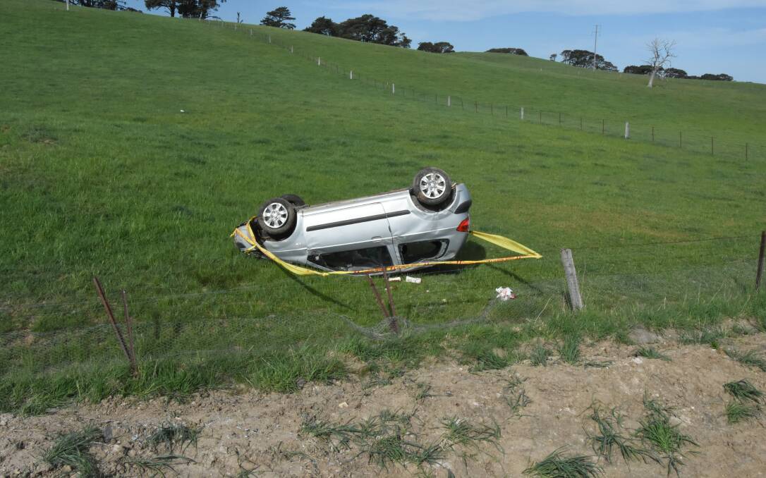 UP-ENDED: The pair travelling in a Hyundai Getz were lucky to have only suffered minor head injuries and abrasions. Photo: MARK LOGAN