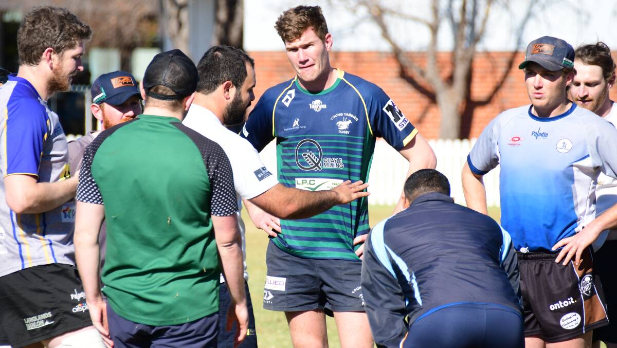 TALKING TACTICS: Peter Fitzsimmons, the Blue Bulls vice-captain, talks to his team-mates during a training session in Dubbo. Photo: AMY McINTYRE
