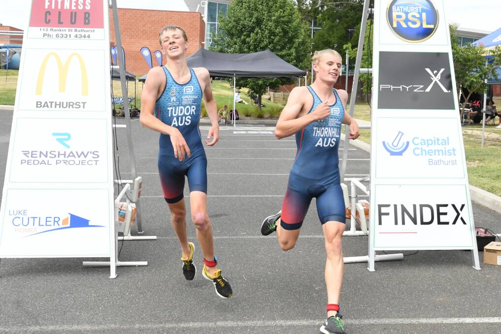 JOINT WINNERS: Tom Tudor and Rory Thornhill cross the line together in the men's long course event. Photo: CHRIS SEABROOK