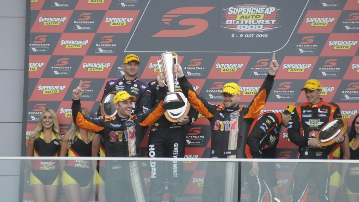 BIG MOMENT: Lifting the Peter Brock Trophy last year is a moment that Will Davison (left) relished. Photo: CHRIS SEABROOK