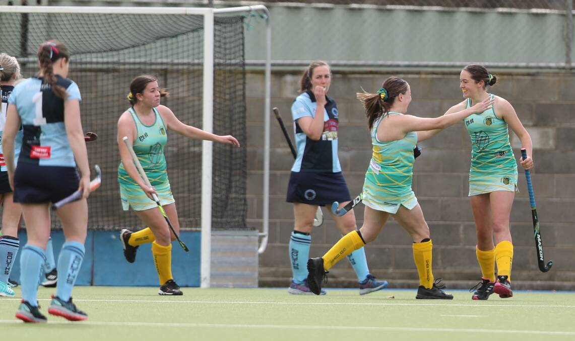 STRIKE FORCE: Orange CYMS celebrate scoring in the opening quarter against Souths. Photo: PHIL BLATCH