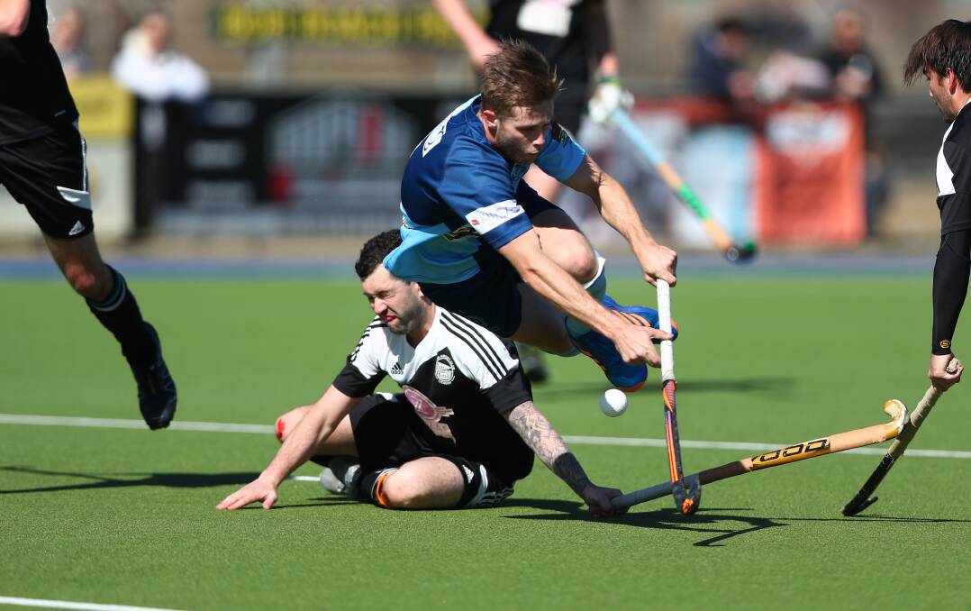 IMPACT: Souths' Nick McEwan is sent flying in this challenge during the minor semi-final against Zig Zag. McEwan bagged two goals in the 6-3 win. Photo: PHIL BLATCH