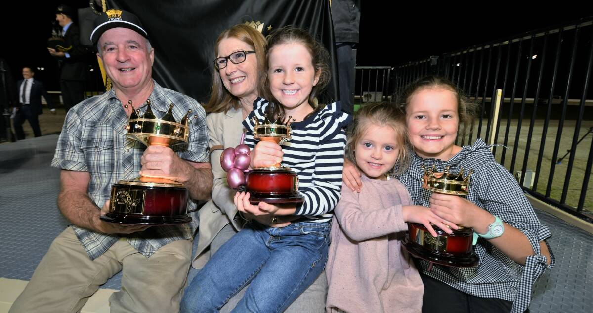 A SWAG OF TROPHIES: Ray Walker with his wife Jane plus their grandkids, Tilly Doherty (7), Isabella Alchin (3) and Myra Doherty(9). Photo: CHRIS SEABROOK 032721cgoldcrwn2