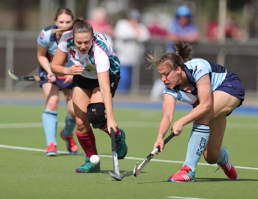 STAND OUT: Daisy Morissey, pictured clearing the ball away from Bathurst City striker Bec Bosianek, was brilliant in defence for Souths. The two blues won the season opener 1-0. Photo: PHIL BLATCH