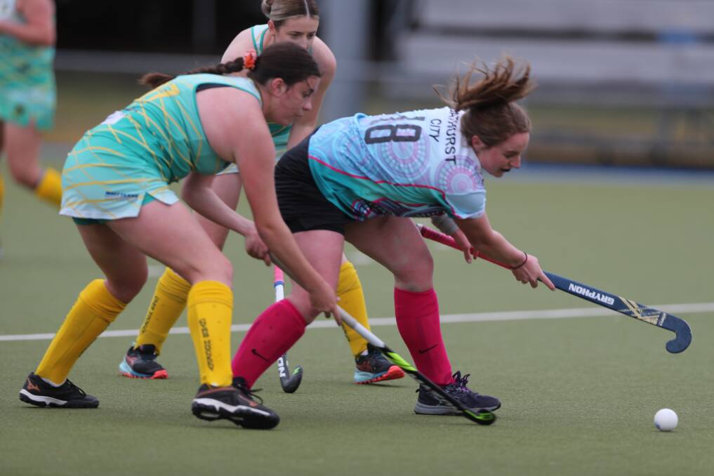 QUALITY CLASH: Orange CYMS held off Bathurst City to post a 3-2 win in their Central West Premier League Hockey match on Saturday. Photos: PHIL BLATCH