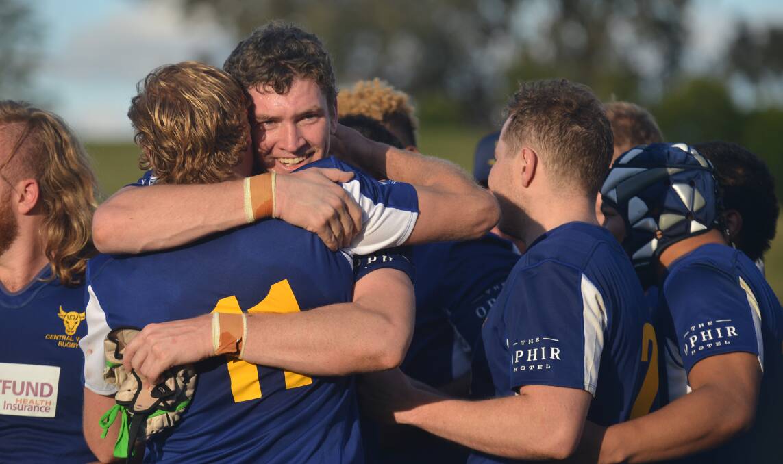TEAM-MATES AND BROTHERS: Justin Mobbs hugs a fellow Blue Bull after last year's Caldwell Cup triumph. Photo: NORTHERN DAILY LEADER