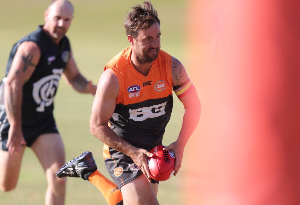 BIG DAY OUT: Bathurst Giants forward Paul Jenkins heads for goal, lining up one of the eight majors he kicked in Saturday's match against Cowra. It took his tally to 25 for the season. Photo: PHIL BLATCH