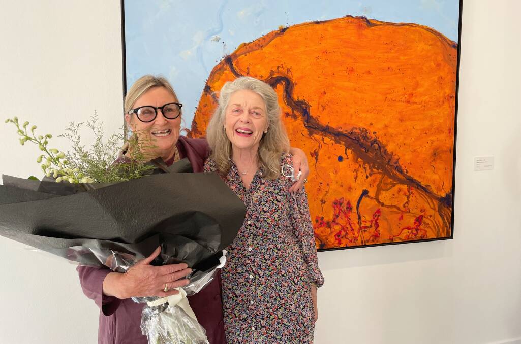 Fem Hawke and Kathy Snowball with the painting renowned Australian artist John Olsen gifted the gallery. 