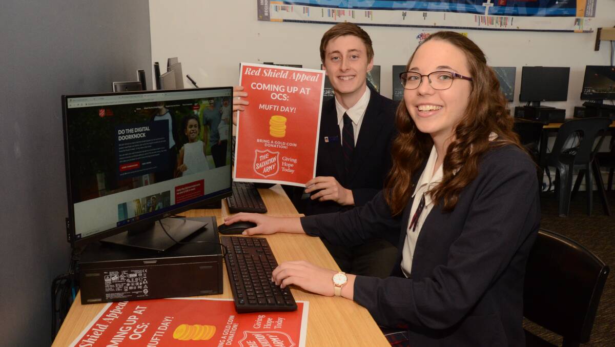 DIGITAL DOORKNOCK: Orange Christian School year 12 students Mitchell Wratten and Hannah Pierce take part in online Red Shield Appeal. Photo: JUDE KEOGH
