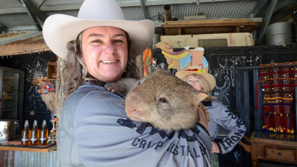 RACE DAY: Nyasa Phillips holding Piglet the wombat. Photo: JUDE KEOGH
