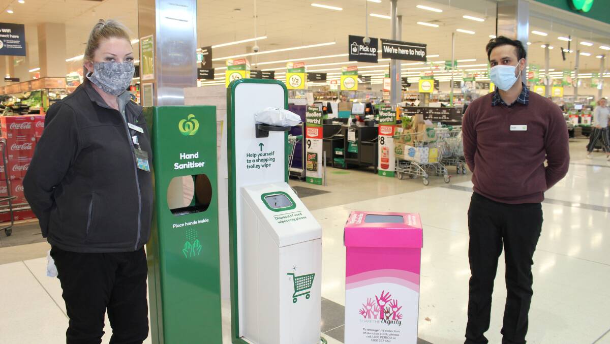 SHARE THE DIGNITY: North Orange Woolworths customer service manager Tracy Ashpole and assistant store manager Harjit Singh ready for August's dignity drive. Photo: ERIKA VASS
