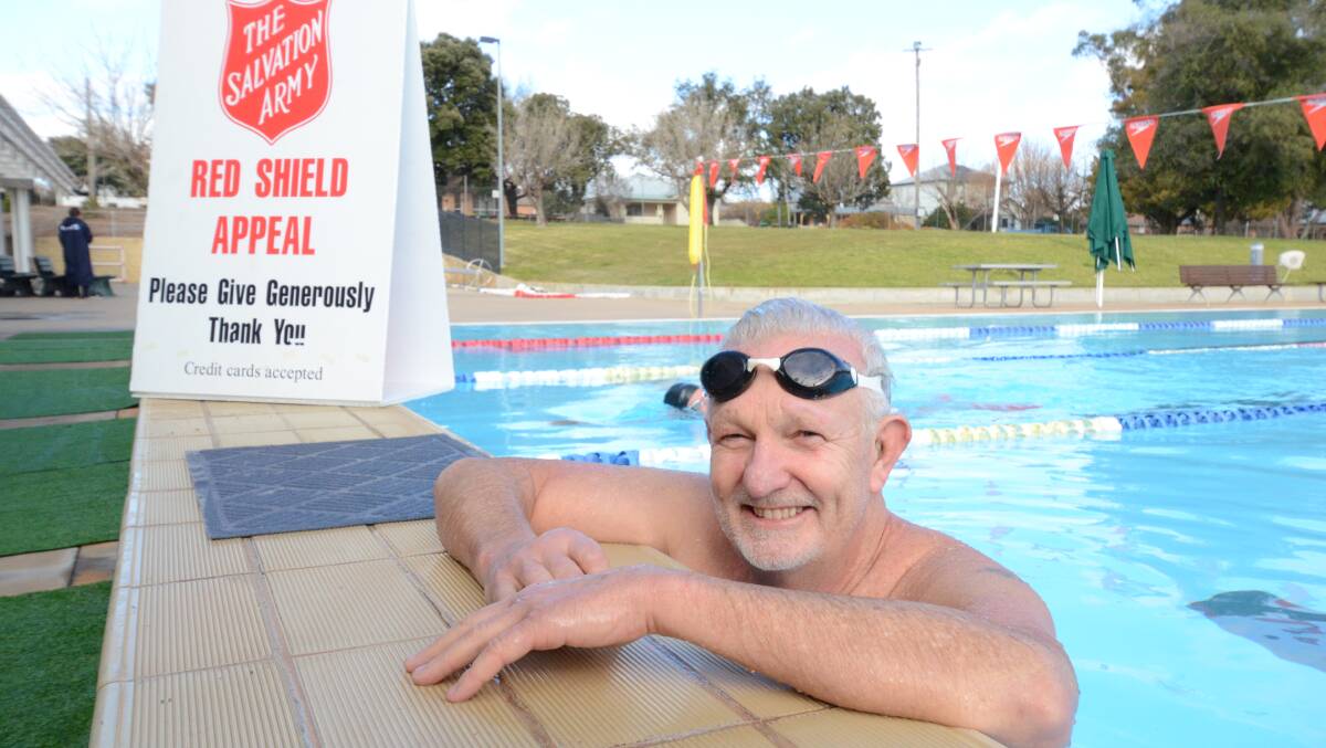 SPLISH SPLASH: Salvation Army store manager Col Barnes swims everyday to raise money for digital doorknock appeal. Photo: JUDE KEOGH