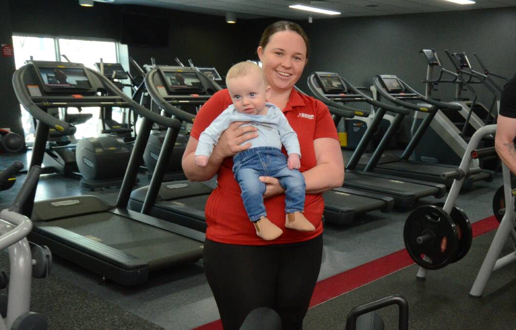 SAFETY MARSHAL: Snap Fitness 24/7 Orange manager Jess Whiley with baby Dallas keeps gym-goers safe during COVID-19. Photo: JUDE KEOGH