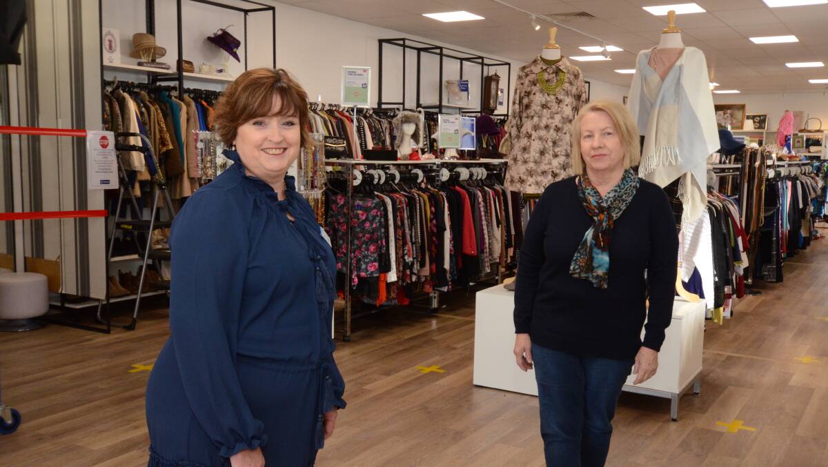 STORE REOPENS: St Vincent de Paul's regional area manager Danielle Curran and volunteer day coordinator Robyn Eid. Photo: JUDE KEOGH 