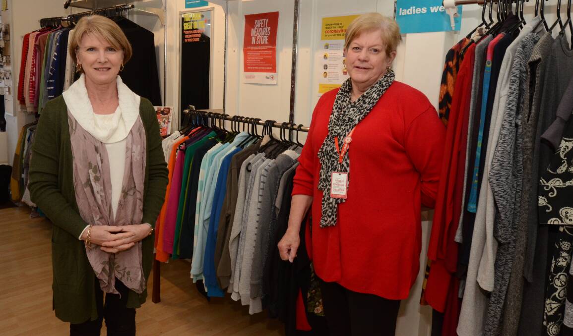 THRIFT SHOPPING: Australian Red Cross store volunteer Carolyn Cox and retail store manager Judy Webber. Photo: JUDE KEOGH
