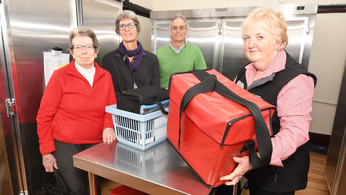 VOLUNTEER DELIVERY: Meals on Wheels Client Anne Wulf, volunteer Catherine Quick, councillor Stephen Nugent and support officer Sheryl Jenkins. Photo: JUDE KEOGH.