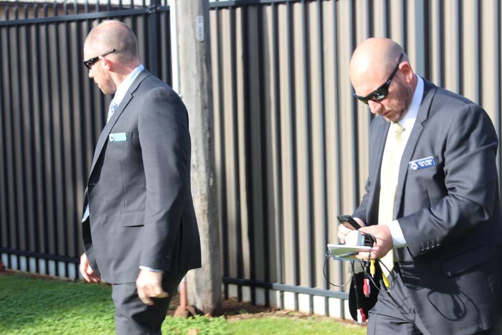 Detectives Justin Milne and Tim Clark arrive at Leeton Courthouse during the murder trial in September 2016. Picture by The Irrigator