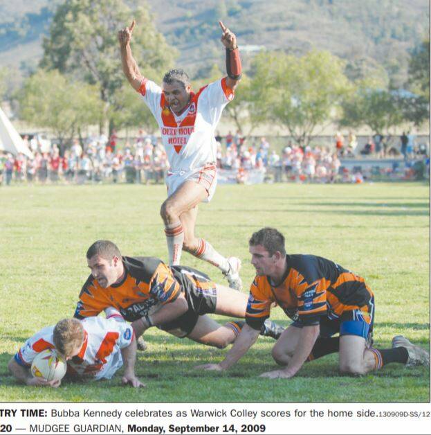 TRY TIME: William Bubba Kennedy enjoys Warick Colley's second try in the 2009 Group 10 grand final. 