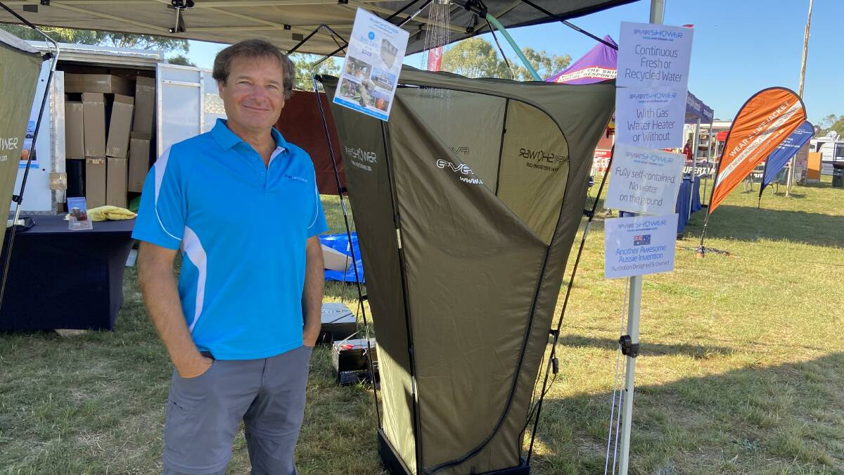 BRISK TRADE: Larry Tofler at the expo with his portable EverShower. Photo: PETER HOLMES