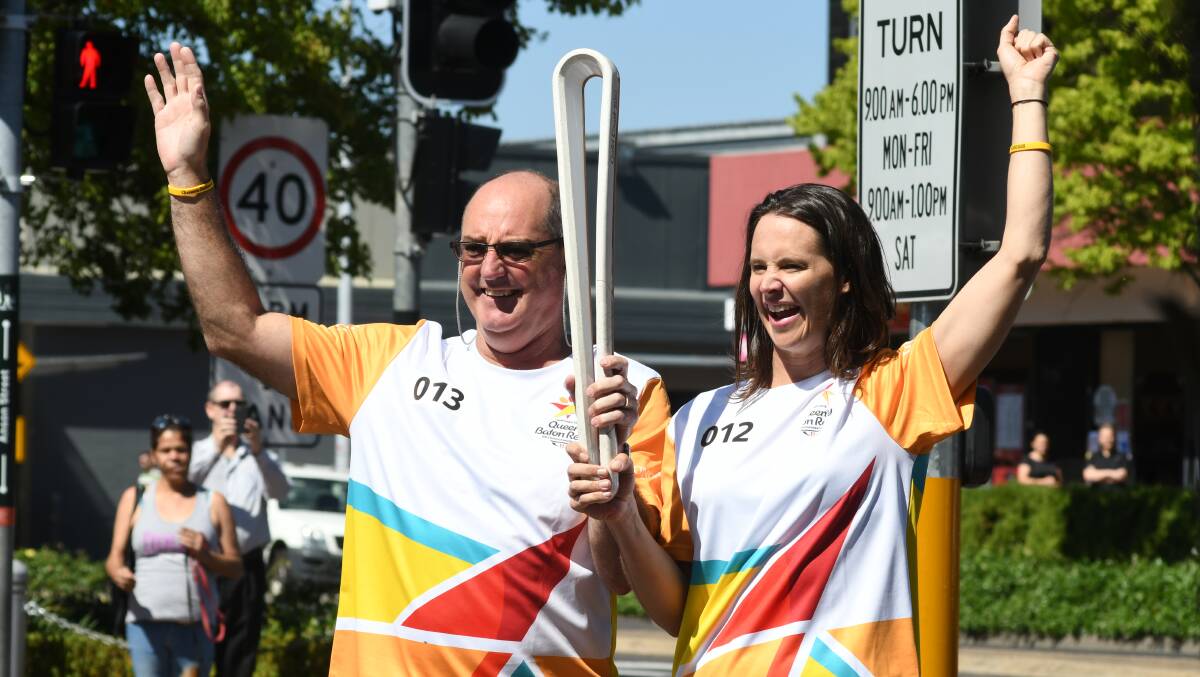 Anna Windsor, pictured with Tony Rodd during the Queen's Baton Relay ahead of the 2018 Commonwealth Games, says the successful Brisbane bid for the 2032 Olympics should inspire our next generation. Photo: JUDE KEOGH