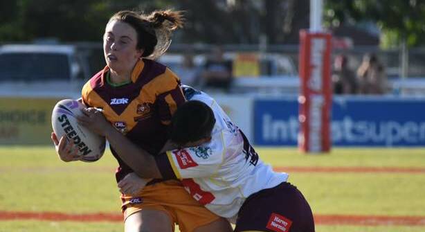 WHAM: Kaitlyn Phillips takes the ball up against Queensland Country. Photo: SAM PASFIELD