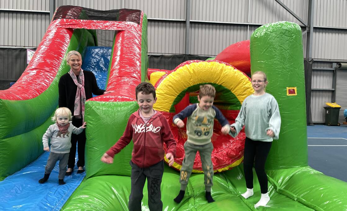 PLAY TIME: Cr Tammy Greenhalgh, Fergus Hardy, Patrick and Cooper Morrison and Ellie O'Neill enjoy the new indoor play equipment at the Orange Indoor Tennis Centre in 2022. 