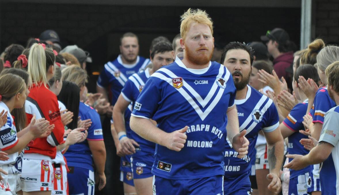 LEADING THE CHARGE: Molong skipper Jim Gavin leads the Bulls out at home in the first round. Molong will meet Manildra in back-to-back weeks. Photo: NICK McGRATH