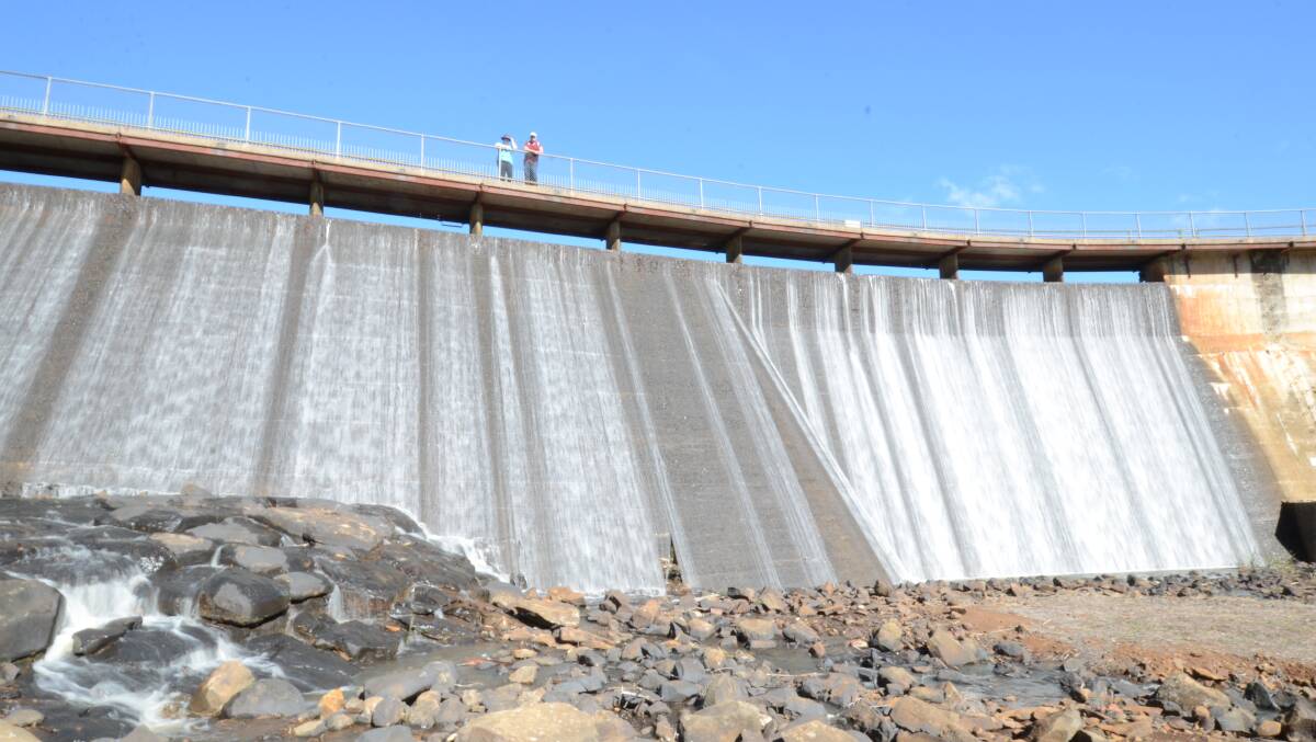 OVER-FLOWING: On the back of our best rainfall in decades, Lake Canobolas is now full with water over-flowing the dam wall. Photo: JUDE KEOGH