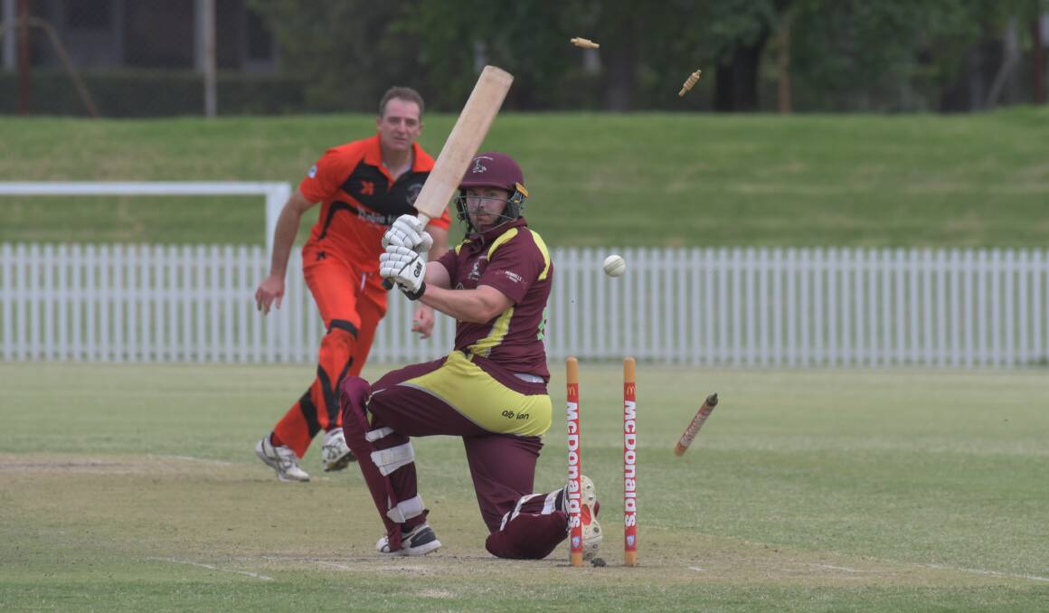 COP THAT: Kyle Buckley loses his middle stump as Daryl Kennewell picks up a third wicket. Photo: JUDE KEOGH