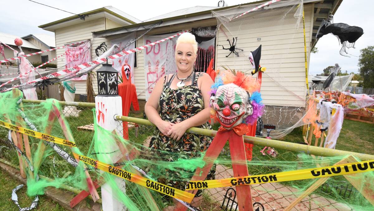 SPOOKY: Trista Smith out the front of her Halloween inspired home in Molong. She's spent weeks putting together her display ahead of Sunday. Photo: JUDE KEOGH