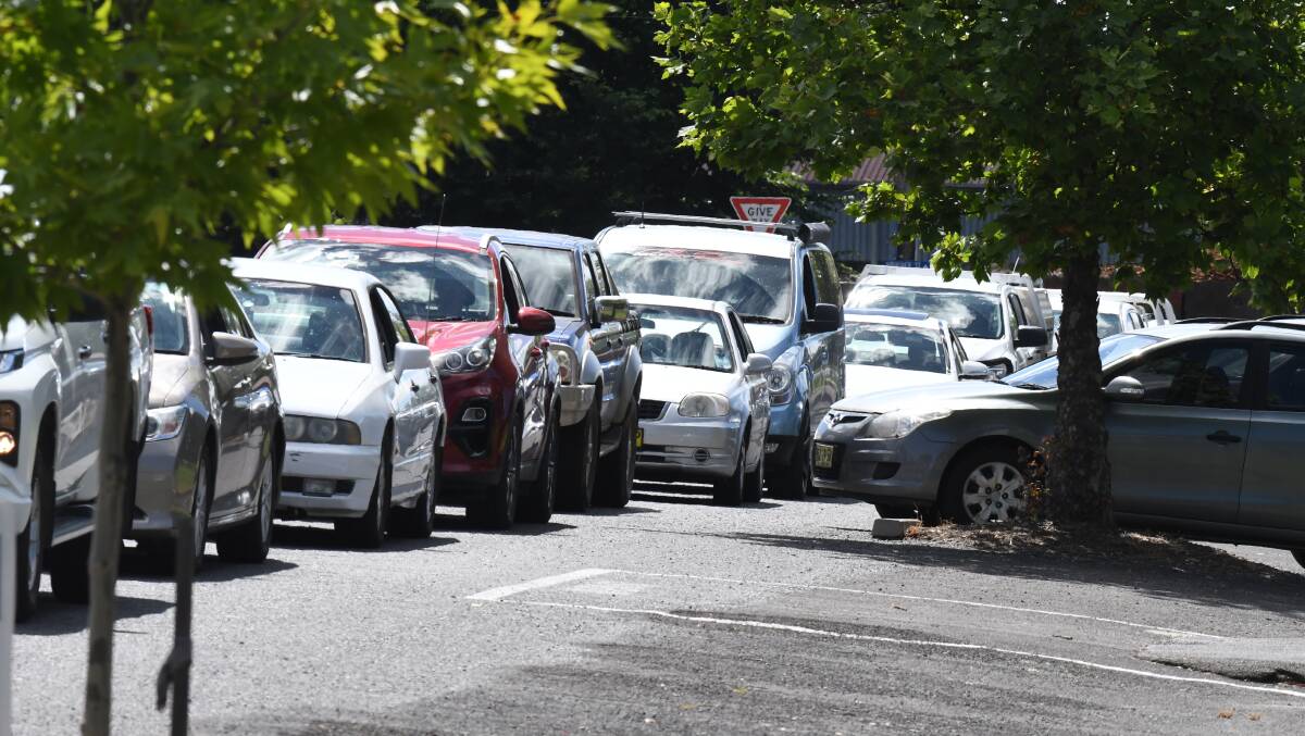 Lines for testing have been lengthy at Wade Park just about all week, often extending past Moulder Street and around on to Peisely Street. Photo: JUDE KEOGH