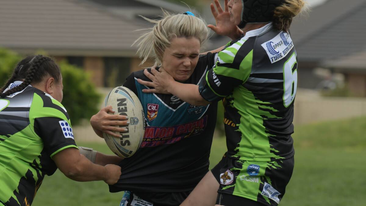 DON'T ARGUE: Vipers star Heidi Regan shrugs off the Castlereagh defence during her side's last home game at Pride Park. Photo: JUDE KEOGH